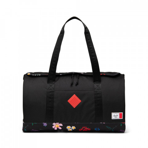 Herschel Heritage weekendtas - zwart met dwarrelende bloemen